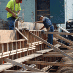 The construction of the southwest retaining wall by Atlas Masonry.